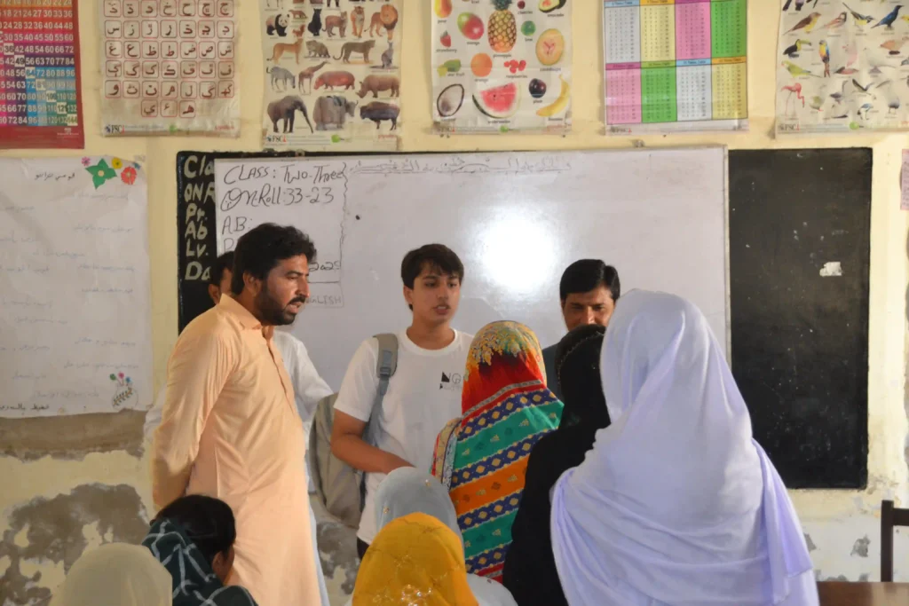 Another student in rural Sindh engaging with a visitor, highlighting the importance of education