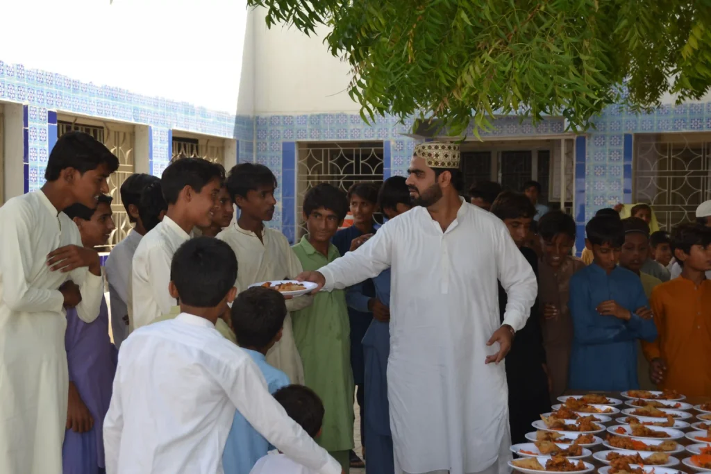 Another image of food distribution, emphasizing support for forgotten children in Sindh