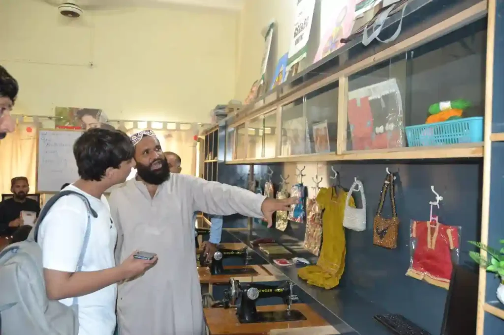 Yahya interacting with students inside a classroom of the Special Education Complex.