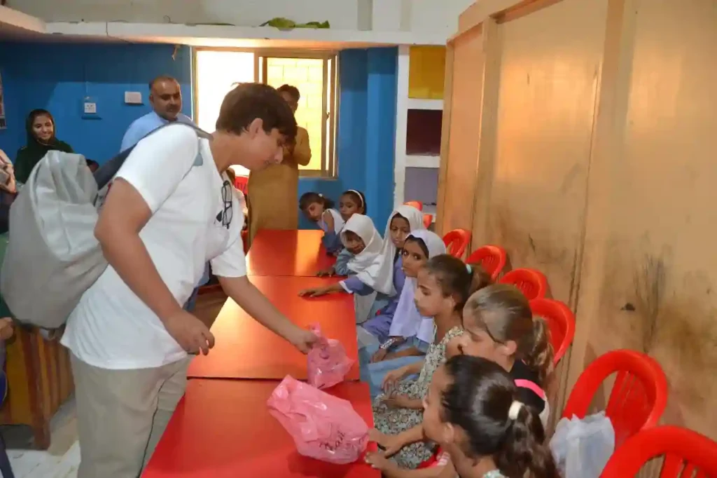 Children smiling with Muhammad Yahya Amir at Special Education Complex, Ghotki