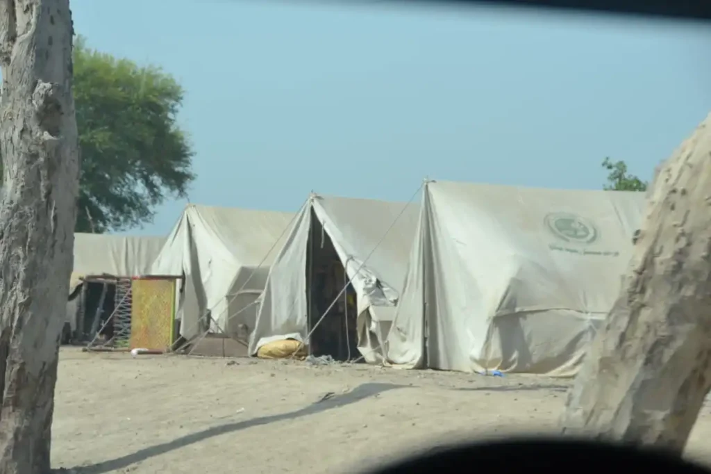 Displaced families find refuge in temporary shelters after Muzaffargarh floods.