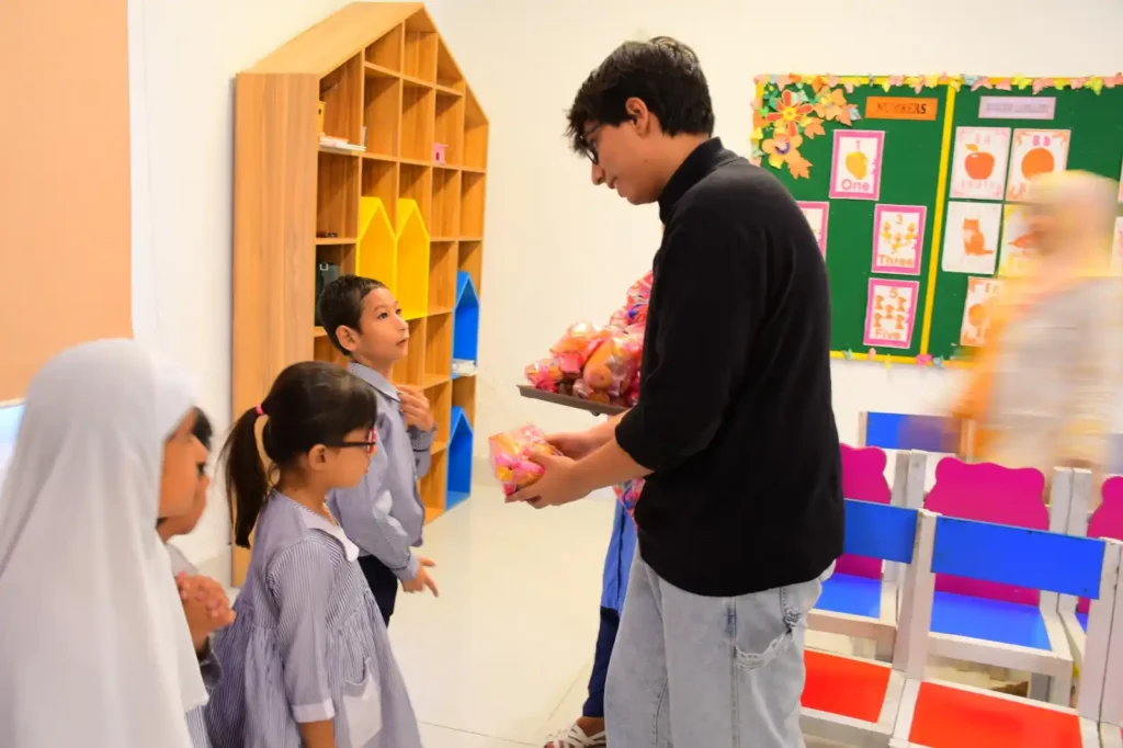 Teacher supporting a student at AISER